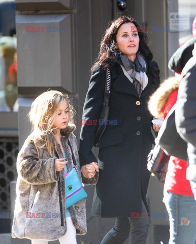 Courteney Cox and her daughter taking a walk