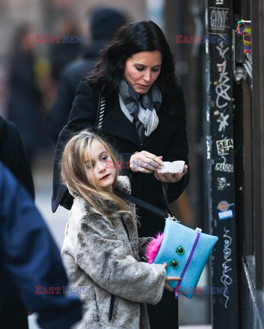 Courteney Cox and her daughter taking a walk