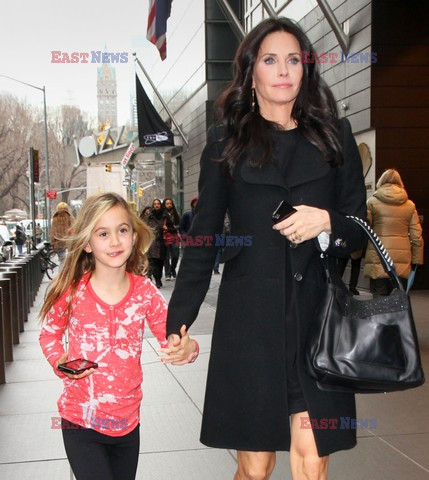 Courteney Cox and her daughter taking a walk
