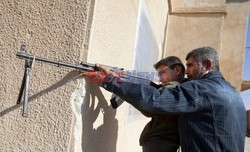 Free Syrian Army youth soldiers attend a training camp 