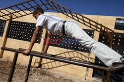 Free Syrian Army youth soldiers attend a training camp 