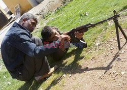 Free Syrian Army youth soldiers attend a training camp 