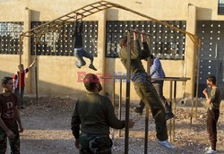 Free Syrian Army youth soldiers attend a training camp 