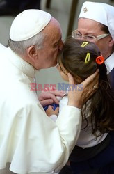 Pope Francis recives a caress from a disabled man 