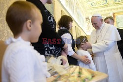 Pope Francis meets a group of sick children